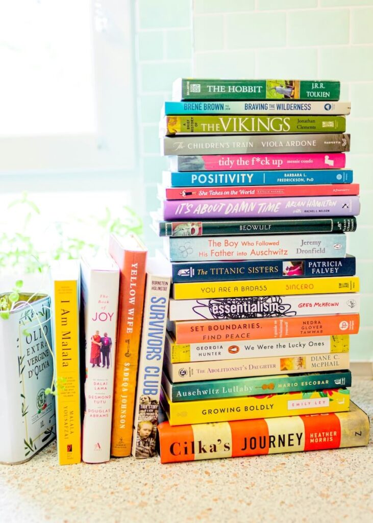 A bright white bookshelf filled with diverse English learning books and teaching materials.